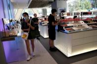 Customers wearing face masks shop at a Chinese cosmetics brand Perfect Diary store, following the coronavirus disease (COVID-19) outbreak in Beijing