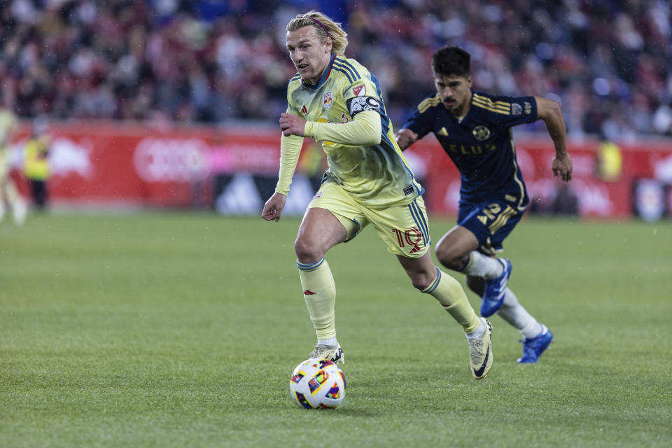 New York Red Bulls midfielder Emil Forsberg (10) runs with the ball during an MLS soccer match against the Vancouver Whitecaps, Saturday, April 27, 2024, in Harrison, N.J. (AP Photo/Stefan Jeremiah)