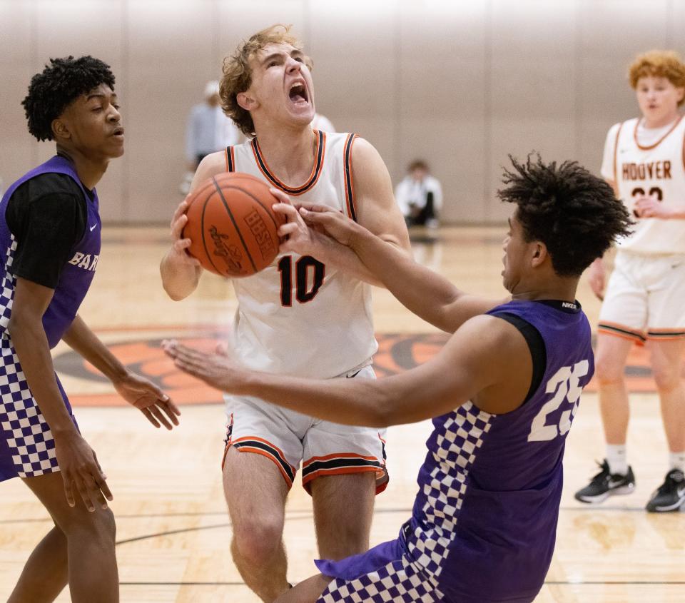 Hoover’s Zac Braucher is called for charging into Barberton’s Mike Jones during the Hoover Hoops MLK Classic on Sunday, Jan. 14, 2024.