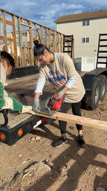 Staff from the Perth Amboy Office of Economic & Community Development volunteering at the Inslee Street build of a Morris Habitat home.