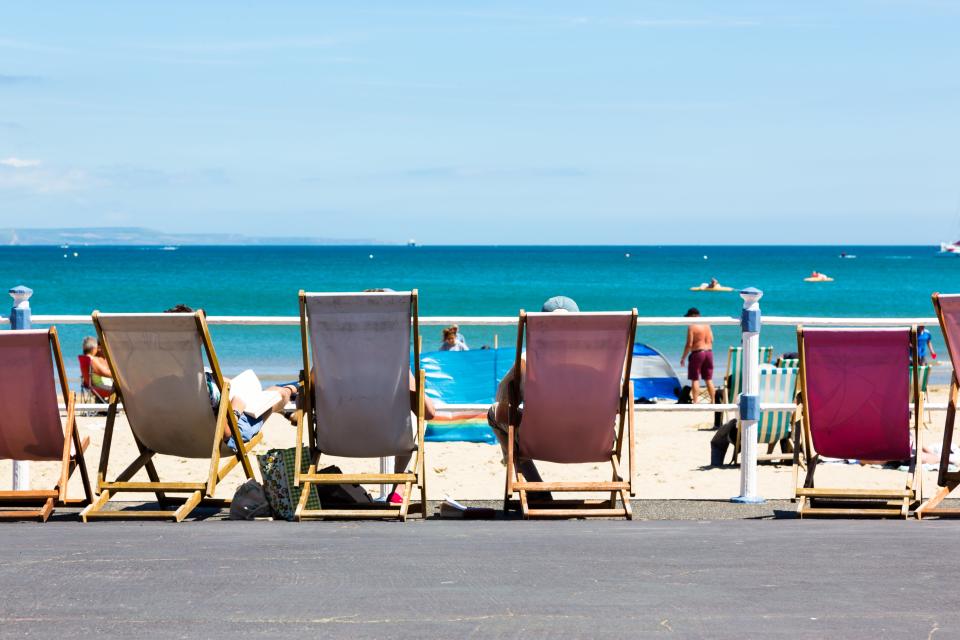 Deck chairs on Weymouth’s long promenade where skaters, mobility scooters, strollers and cyclists trundle (Tommy Lee Walker - stock.adobe.com)