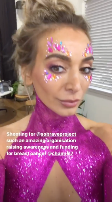 A photo of Nadia Bartel covered in pink body glitter on set of The All New Monty: Ladies' Night. Photo: Instagram/nadiabartel.