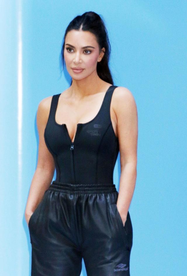 Khloe Kardashian puts her curves on display in a skin-tight bodysuit