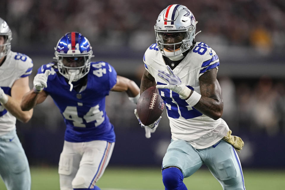 Dallas Cowboys wide receiver CeeDee Lamb (88) carries in front of New York Giants cornerback Nick McCloud (44) after a pass reception in the first half of an NFL football game, Sunday, Nov. 12, 2023, in Arlington, Texas. (AP Photo/Tony Gutierrez)