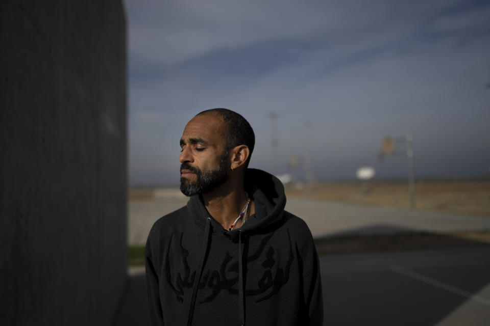 Filmmaker Sol Guy stands for a photo at Valley State Prison in Chowchilla, Calif., Friday, Nov. 4, 2022, after the advance screening of his personal film, "The Death of My Two Fathers," at the prison. The screening was held in the prison's gymnasium which, until that day, had been closed for recreational activities like basketball as part of ongoing COVID restrictions. (AP Photo/Jae C. Hong)