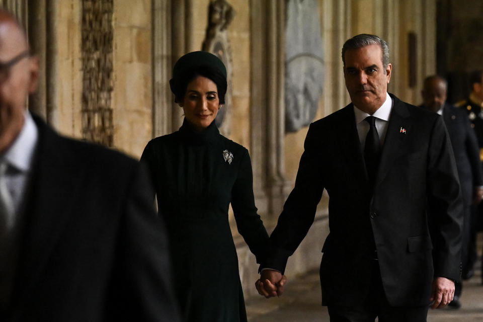 Dominican President Luis Abinader and his wife Raquel Arbaje arrive for the coronation at Westminster Abbey. / Credit: BEN STANSALL/POOL/AFP via Getty Images