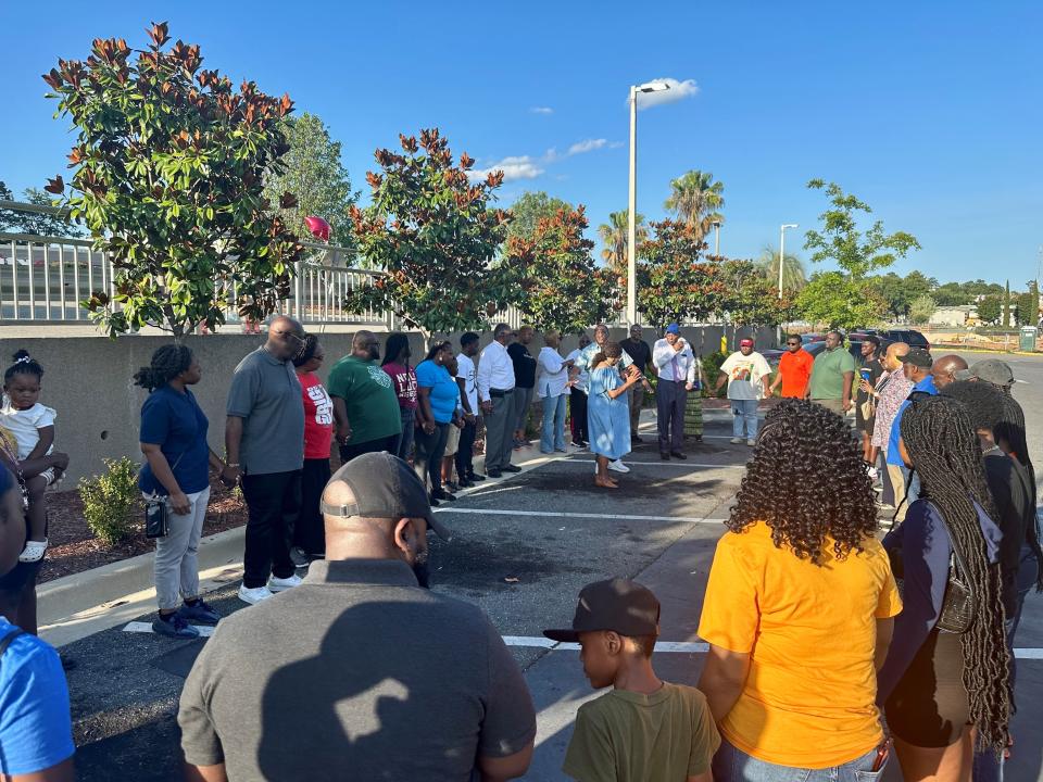 The Tallahassee Citywide Prayer Warriors hold a prayer vigil on Monday, June 26, 2023, in the parking lot of the McDonald's on West Pensacola Street. Two men, 18 and 21, were killed in a shooting outside the restaurant on June 23.