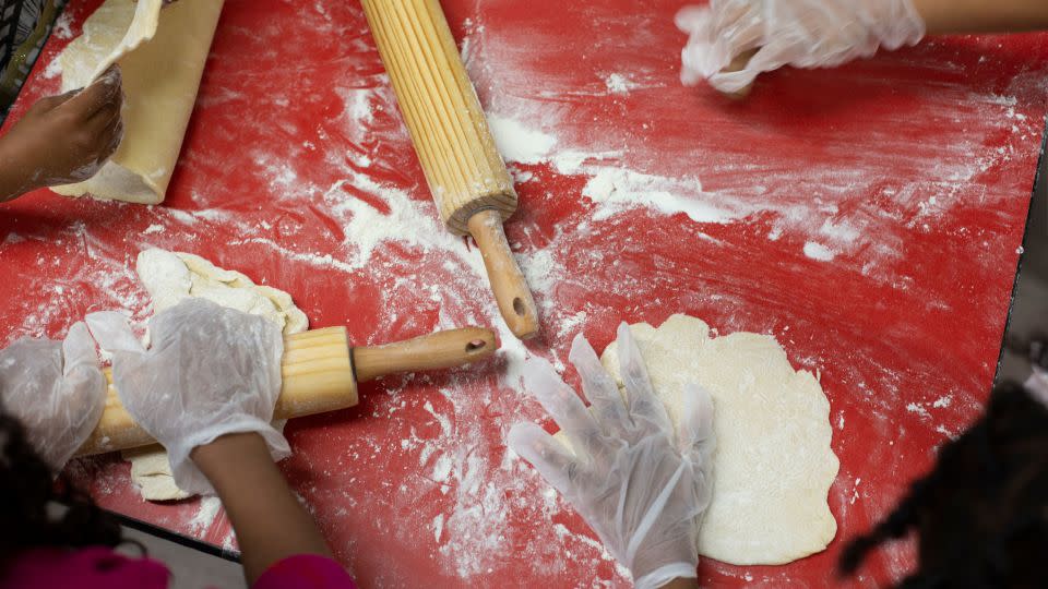 Children prepare pie dough at Robert F. Wagner Middle School in New York. - Laura Oliverio/CNN