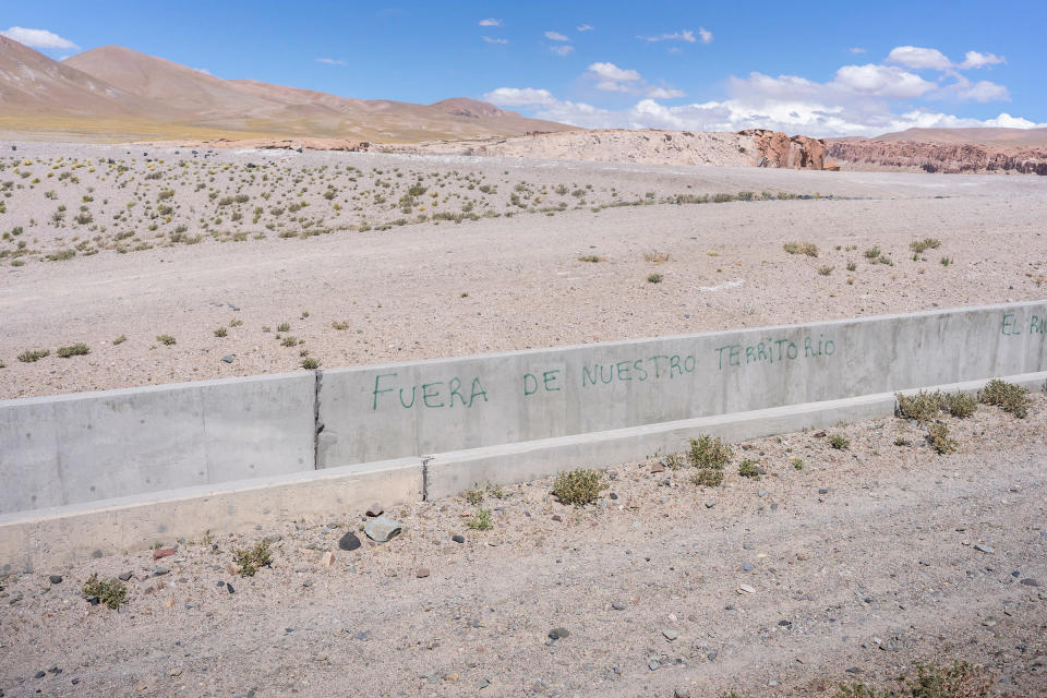 Activists have scrawled 'Get off our land' on an aqueduct at Livent's Hombre Muerto lithium mine.<span class="copyright">Sebastián López Brach for TIME</span>