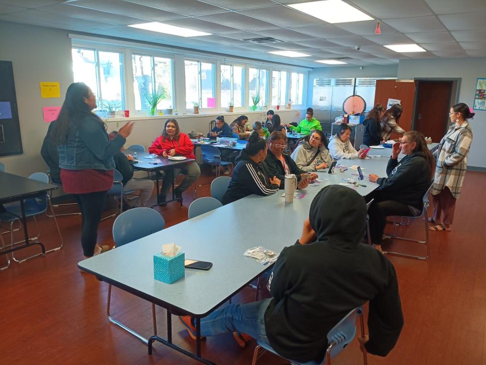 Ho-Chunk Language Division staff show tribal members how to use a new language learning app at the tribe's community center in Milwaukee in May 2024.