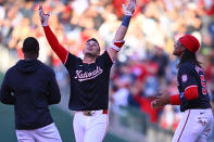 Washington Nationals' Joey Meneses, center, celebrates with teammates after driving in the game winning run in the 10th inning of a baseball game against the Houston Astros at Nationals Park, Saturday, April 20, 2024, in Washington. (AP Photo/John McDonnell)