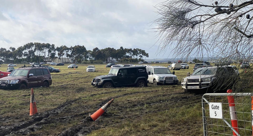 Vehicles stuck in the mud at the Crowded House concert..