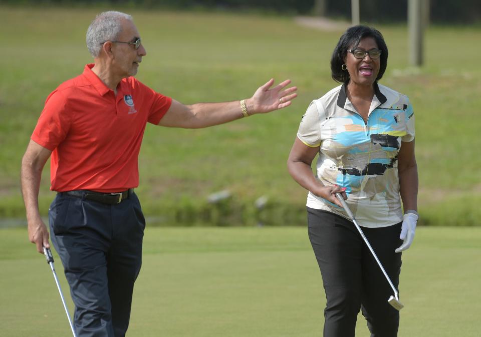 Jacksonville City Council member Ron Salem and Joyce Morgan, who also was on City Council at the time, joke around after making the reopening putts on the green of the 9th hole at Blue Cypress Golf Course in Arlington on April 9, 2021. Salem said he wants the city to add three more holes to the course.
