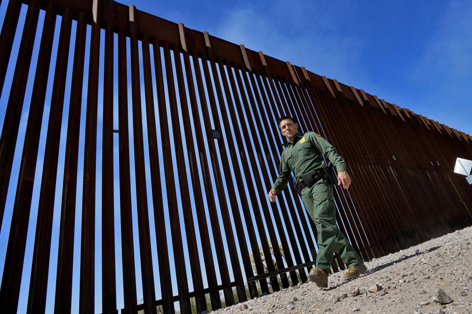 Border Patrol Deputy Chief for the Tucson Sector Justin De La Torre walks along the border fence of the U.S.-Mexico border, Tuesday, Aug. 29, 2023, in Organ Pipe Cactus National Monument near Lukeville, Ariz. U.S. Customs and Border Protection reports that the Tucson Sector is the busiest area of the border since 2008 due to smugglers abruptly steering migrants from Africa, Asia and other places through some of the Arizona borderlands' most desolate and dangerous areas. (AP Photo/Matt York)