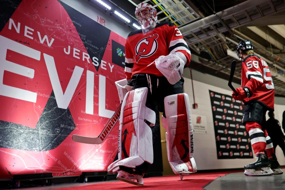 New Jersey Devils goaltender Jon Gillies walks to the ice to face the Los Angeles Kings in an NHL hockey game Sunday, Jan. 23, 2022, in Newark.