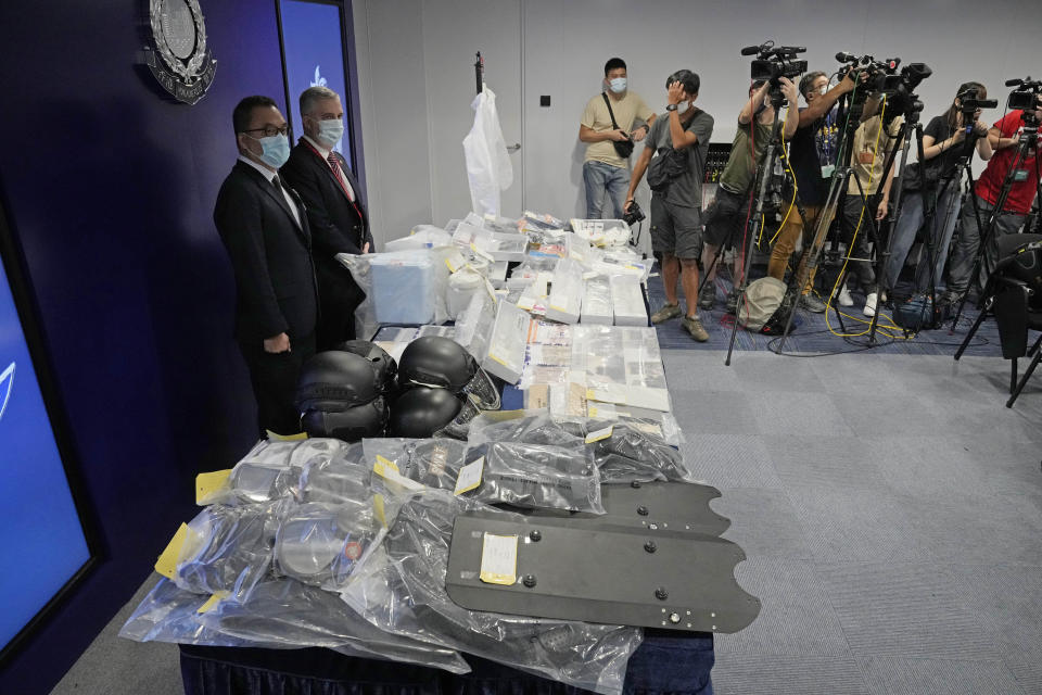 Confiscated evidence is displayed during a news conference as several people were arrested over the alleged plot to plant bombs around Hong Kong, at the police headquarters in Hong Kong, Tuesday, July 6, 2021. Hong Kong police on Tuesday said they arrested nine people on suspicion of engaging in terrorist activity, after uncovering an attempt to make explosives and plant bombs across the city.(AP Photo/Kin Cheung)