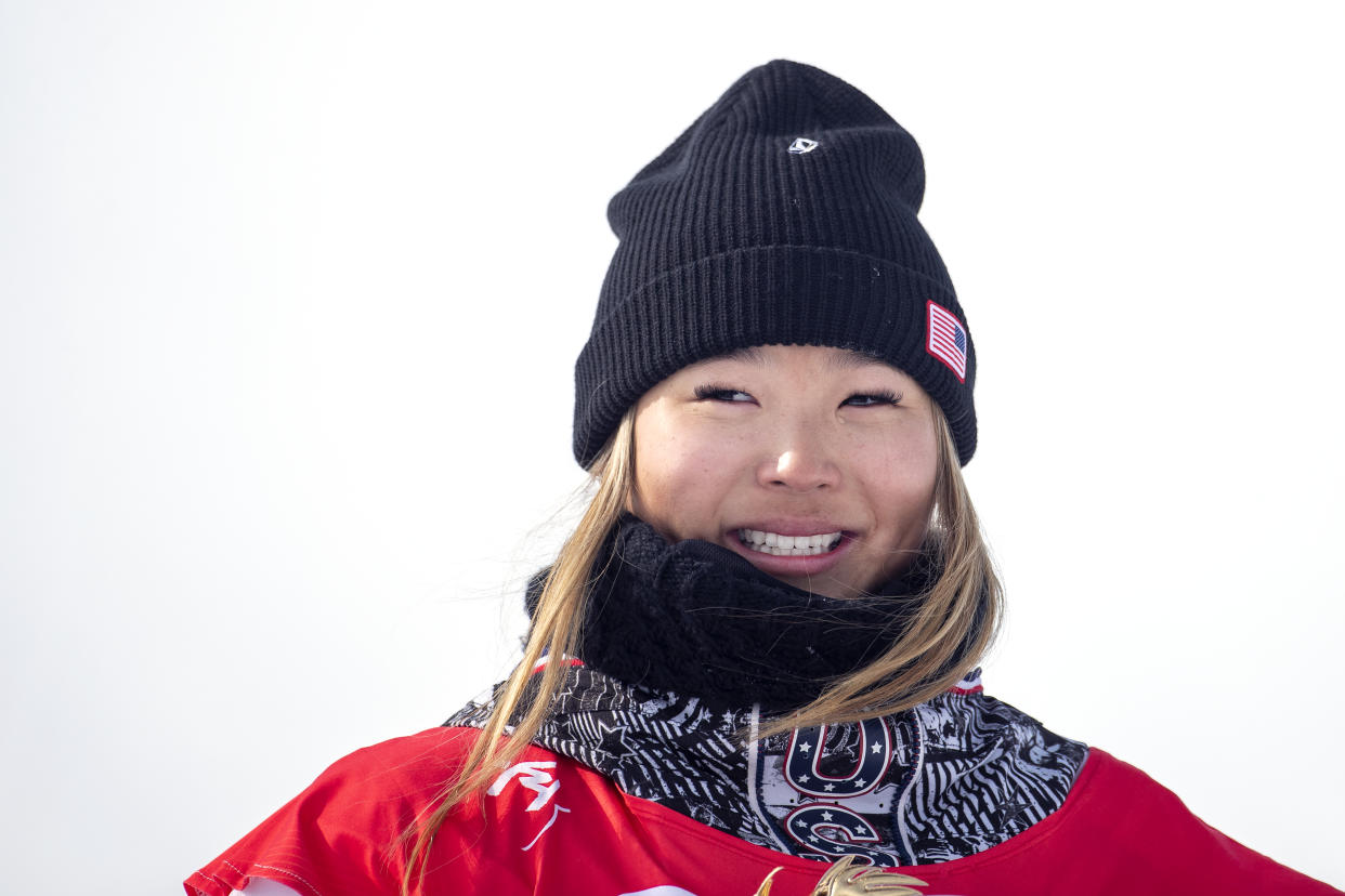 BEIJING, CHINA - February 10:  Chloe Kim of the United States reacts on the podium after winning the gold medal in the Women's Snowboard Halfpipe Final at Genting Snow Park during the Winter Olympic Games on February 10th, 2022 in Zhangjiakou, China.  (Photo by Tim Clayton/Corbis via Getty Images)