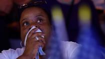 A Hillary Clinton supporter watches the updates at the US Democrats Abroad election gathering in Sydney on Wednesday. Photo: AAP