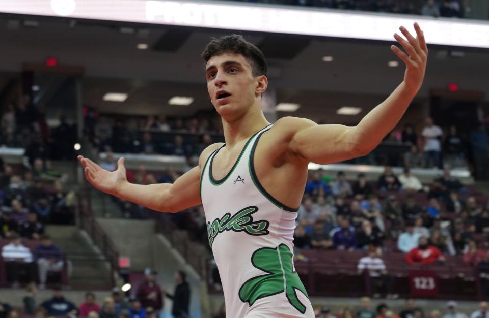 Dublin Coffman’s Omar Ayoub celebrates is win against Pickerington Central’s Brennen Cernus during the OHSAA wrestling finals at the Schottenstein Center in Columbus, Ohio, on Sunday, March 13, 2022. Ayoub won the Division I 126 pound weight class.