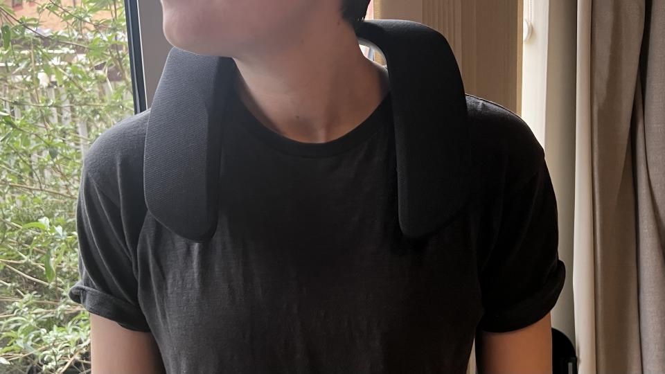 Reviewer wearing Panasonic Soundslayer Wireless neck speaker