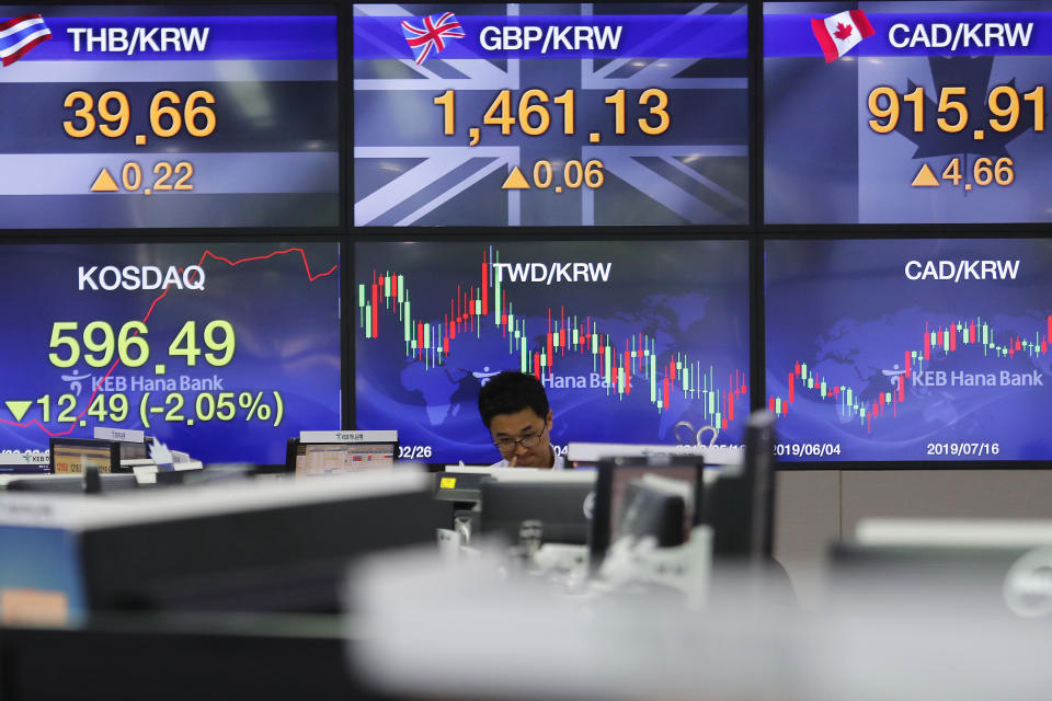 A currency trader watches monitors at the foreign exchange dealing room of the KEB Hana Bank headquarters in Seoul, South Korea, Monday, Aug. 26, 2019. Asian shares tumbled Monday after the latest escalation in the U.S.-China trade war renewed uncertainties about global economies, as well as questions over what U.S. President Donald Trump might say next. (AP Photo/Ahn Young-joon)
