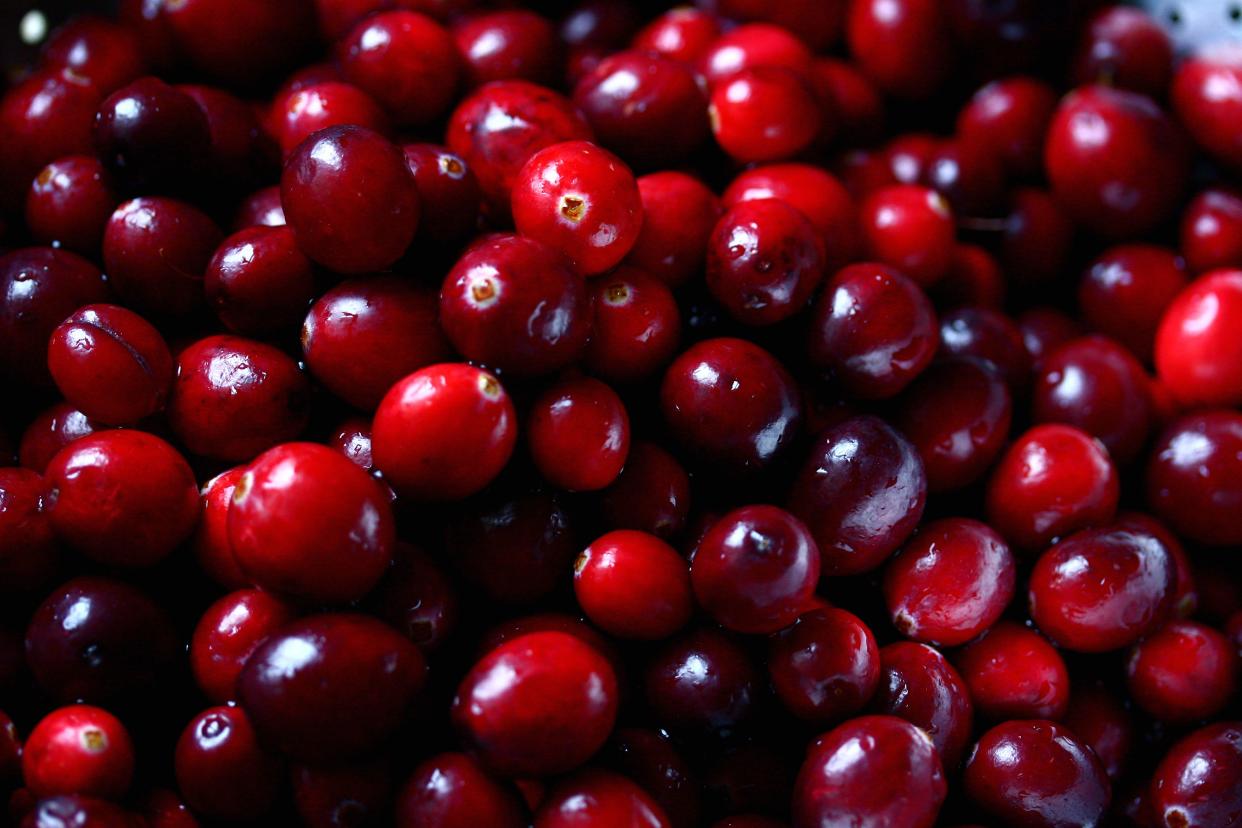 Dark red shiny cranberries.