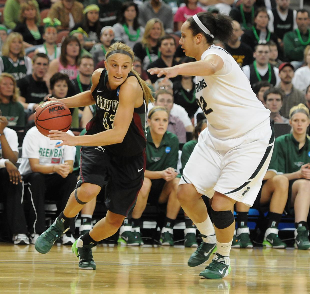 UWGB's Kayla Tetschlag, left, drives against Michigan State's Kalisha Keane during a second-round NCAA Tournament game in 2011.
