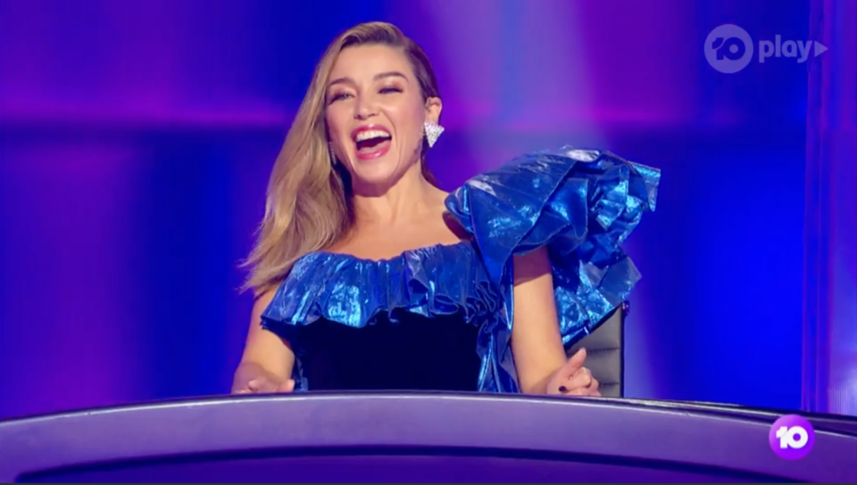 Danni Minogue on The Masked Singer in a blue and black dress