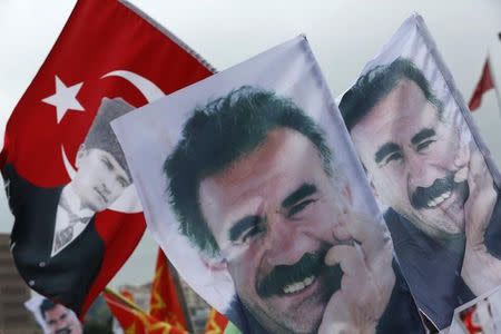 Flags with a picture of the jailed Kurdish militant leader Abdullah Ocalan and of modern Turkey's founder Mustafa Kemal Ataturk (L) are pictured during a gathering of supporters of the Pro-Kurdish Peoples' Democratic Party (HDP) to celebrate the party's victory during the parliamentary election, in Istanbul, Turkey, June 8, 2015. REUTERS/Murad Sezer
