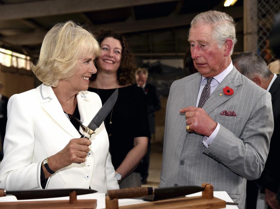 Britain's Prince Charles and his wife Camilla (L), Duchess of Cornwall visit Seppeltsfield Winery in Barossa Valley of South Australia, some 70 kilometres north-east of Adelaide on November 10, 2015. Prince Charles and his wife Camilla are on a two-week tour of New Zealand and Australia. AFP PHOTO / POOL / DANIEL KALISZ        (Photo credit should read DANIEL KALISZ/AFP via Getty Images)