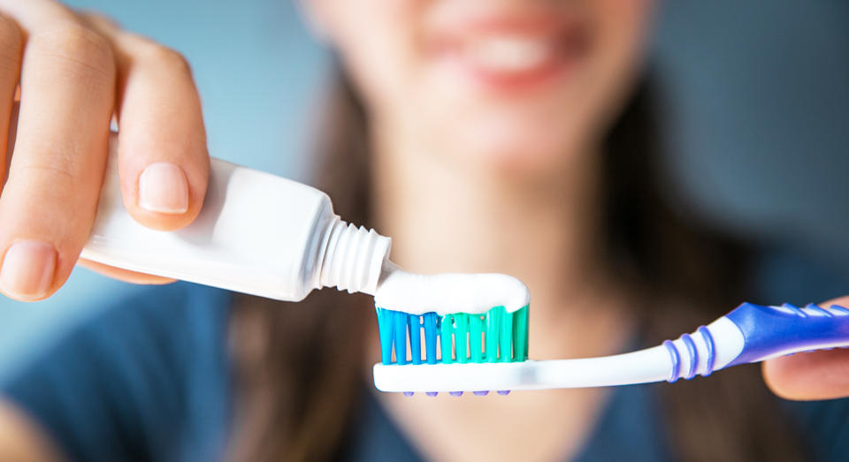 Rinsing your teeth rather than spitting out your toothpaste is apparently the wrong approach. [Photo: Getty]