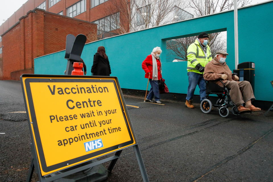 People queue outside a vaccination centre for the coronavirus disease (COVID-19), outside IMEX House in Hemel Hempstead, Britain, January 8, 2021. REUTERS/Paul Childs