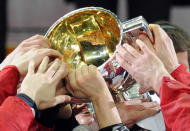 Russian players celebrate with a trophy after a final game of the IIHF International Ice Hockey World Championship in Helsinki on May 20, 2012, as Team Russia defeated team Slovakia 6-2 . AFP PHOTO/ ALEXANDER NEMENOVALEXANDER NEMENOV/AFP/GettyImages