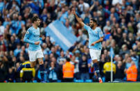 Soccer Football - Premier League - Manchester City v Burnley - Etihad Stadium, Manchester, Britain - October 20, 2018 Manchester City's Riyad Mahrez celebrates scoring their fourth goal with John Stones Action Images via Reuters/Jason Cairnduff