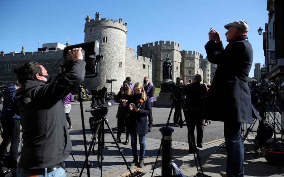 Members of the media gather outside Windsor Castle  - Reuters