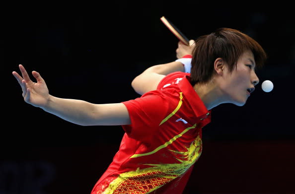LONDON, ENGLAND - AUGUST 06: Ning Ding of China in action against Kyungah Kim of Korea during the women's team table tennis semifinals on Day 10 of the London 2012 Olympic Games at ExCeL on August 6, 2012 in London, England. (Photo by Ezra Shaw/Getty Images)
