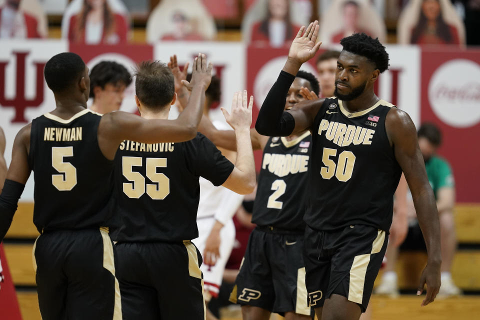 Purdue's Trevion Williams (50) celebrates with Brandon Newman (5) after Williams hit a shot and was fouled during the second half of the team's NCAA college basketball game against Indiana, Thursday, Jan. 14, 2021, in Bloomington Ind. Purdue won 81-69. (AP Photo/Darron Cummings)
