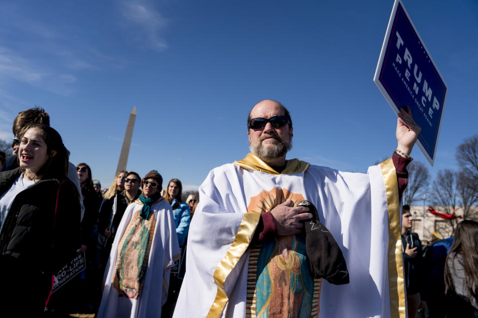 <p>Lis Kelly of Notre Dame, Ind., background, and her friend Brother Tomasio Venditti of Steubenville, Ohio, right, wear white gowns depicting the Lady of Guadalupe the Roman Catholic title of the Blessed Virgin Mary during an anti-abortion rally on the National Mall in Washington, Friday, Jan. 19, 2018, during the annual March for Life. Thousands of anti-abortion demonstrators gather in Washington for an annual march to protest the Supreme Court’s landmark 1973 decision that declared a constitutional right to abortion. (Photo: Andrew Harnik/AP) </p>