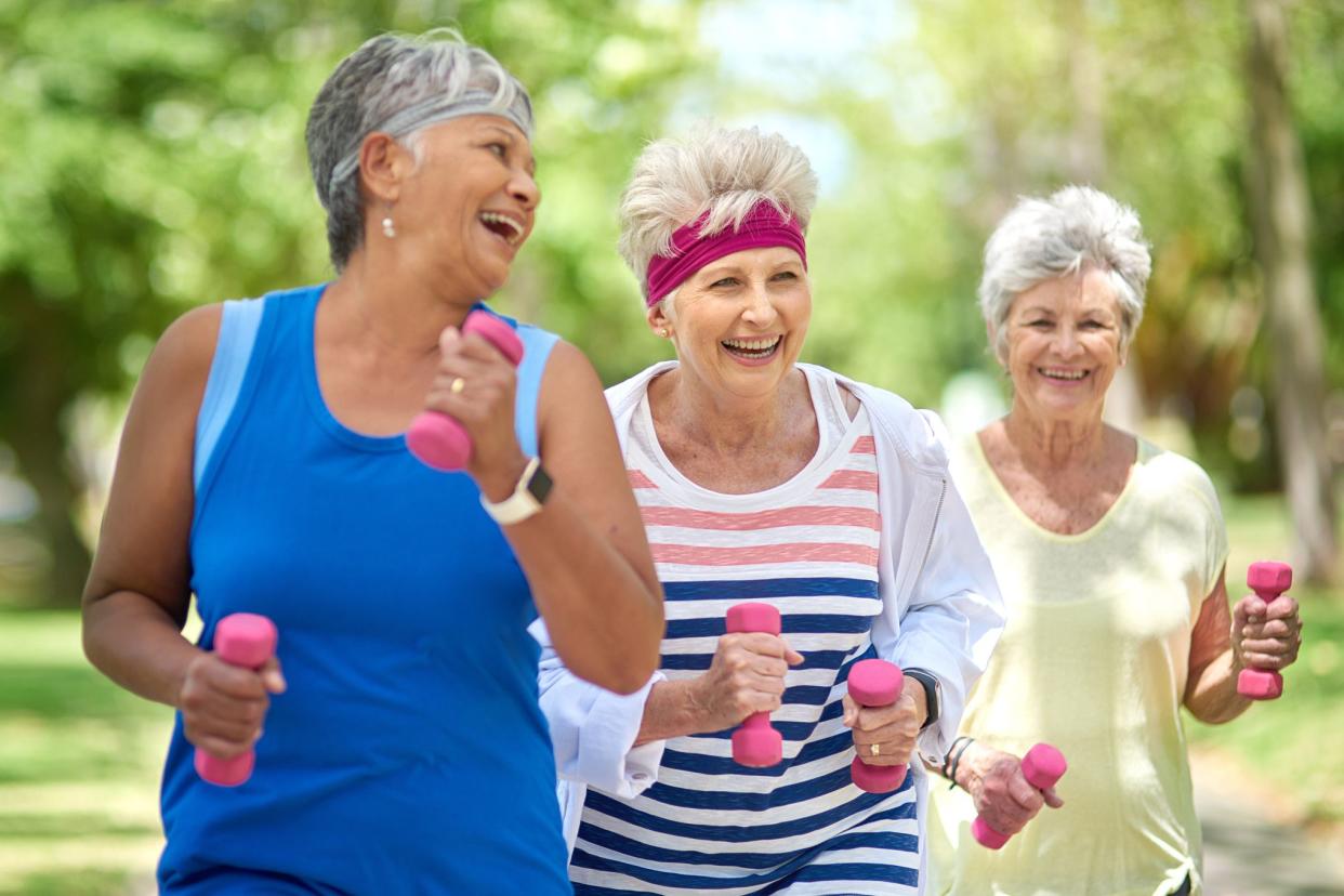 middle-aged women walking with weights