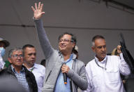 FILE - Then-Historical Pact coalition presidential candidate Gustavo Petro waves at supporters during a closing campaign rally in Zipaquira, Colombia, May 22, 2022. Petro, Colombia's first elected leftist president, will take office in August with ambitious proposals to halt the record-high rates of deforestation in the Amazon. (AP Photo/Fernando Vergara, File)