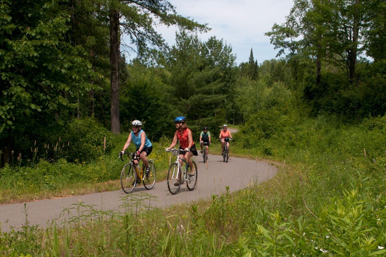 Bikers on the Paul Bunyan Bike Trail between hacksensack and hwy 34