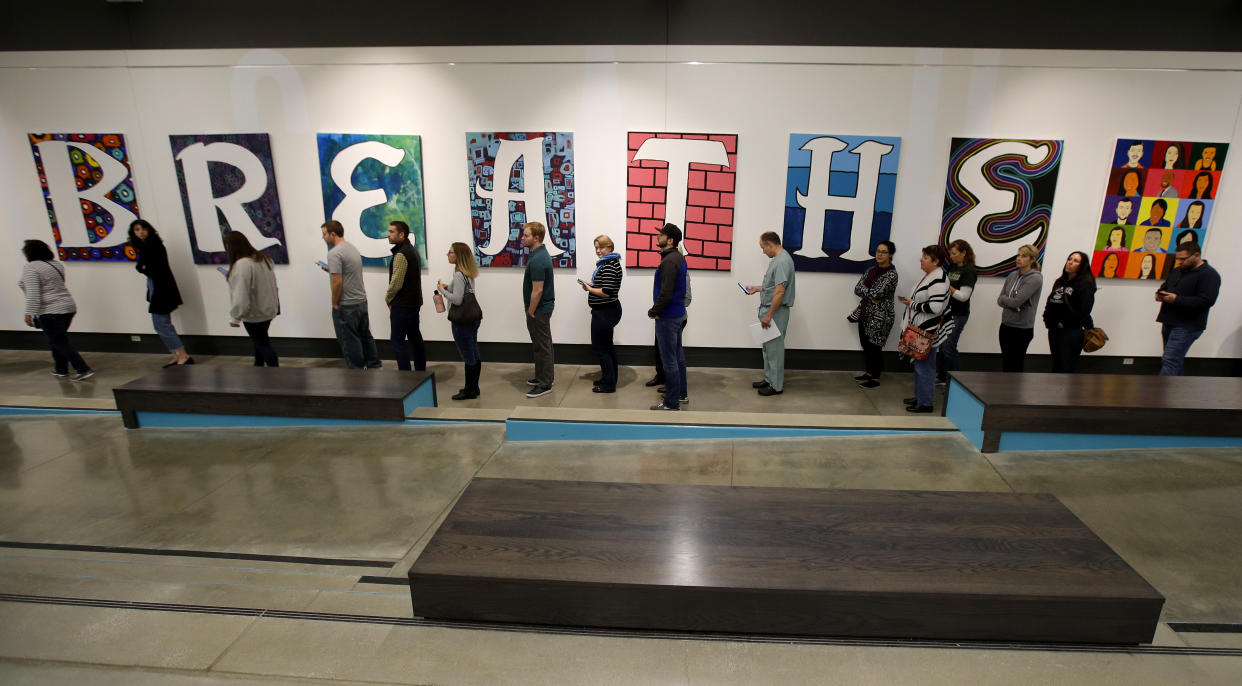 Voters line up to cast their ballots for early voting at the Johnson County Arts & Heritage Center in Overland Park, Kan. on Nov. 2. (Photo: Charlie Riedel/AP)