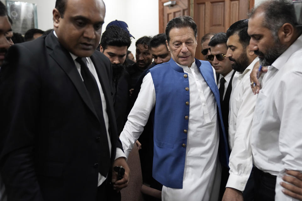 Pakistan's former Prime Minister Imran Khan arrives to sign documents as he submits surety bond over his bails in different cases at an office of Lahore High Court in Lahore, Pakistan, Tuesday, July 18, 2023. (AP Photo/K.M. Chaudary)