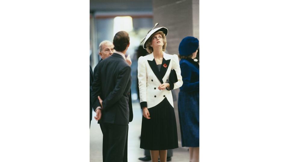 Princess Diana looking up in black and white outfit