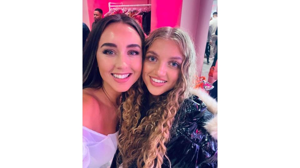 Emily and Princess posing for a selfie at a glam event 