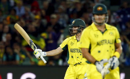 Australian batsman Steve Smith acknowledges the crowd after scoring 50 runs alongside team mate Shane Watson during their Cricket World Cup quarter final match against Pakistan in Adelaide, March 20, 2015. REUTERS/David Gray