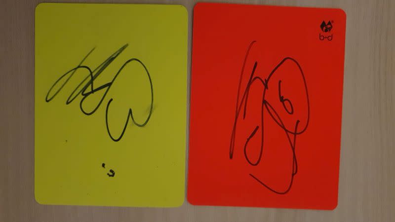 A handout image of cards signed by Borussia Dortmund striker Erling Haaland to raise money for autism charity