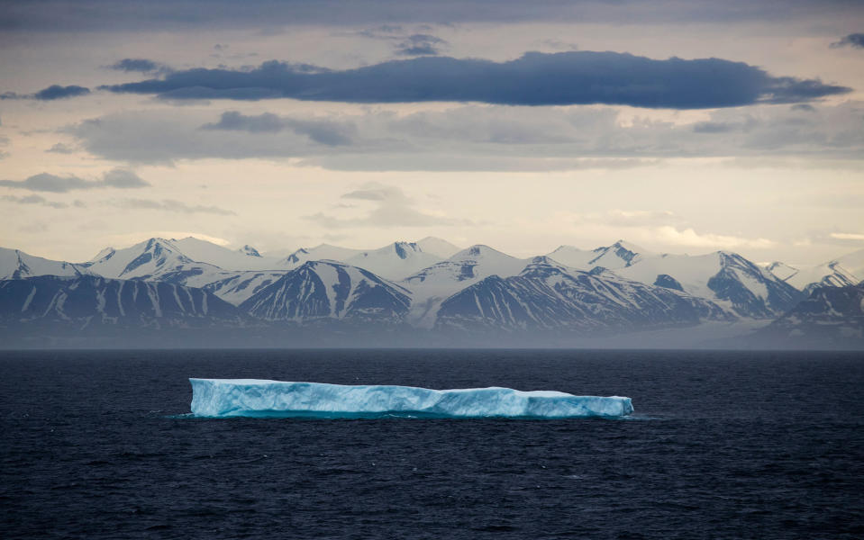 <p>JUL. 24, 2017 – An iceberg floats past Bylot Island in the Canadian Arctic Archipelago. Icebergs aren’t sea ice, despite being best known for floating about the ocean. They are actually chunks of glaciers that have broken off at the water’s edge. (Photo: David Goldman/AP) </p>