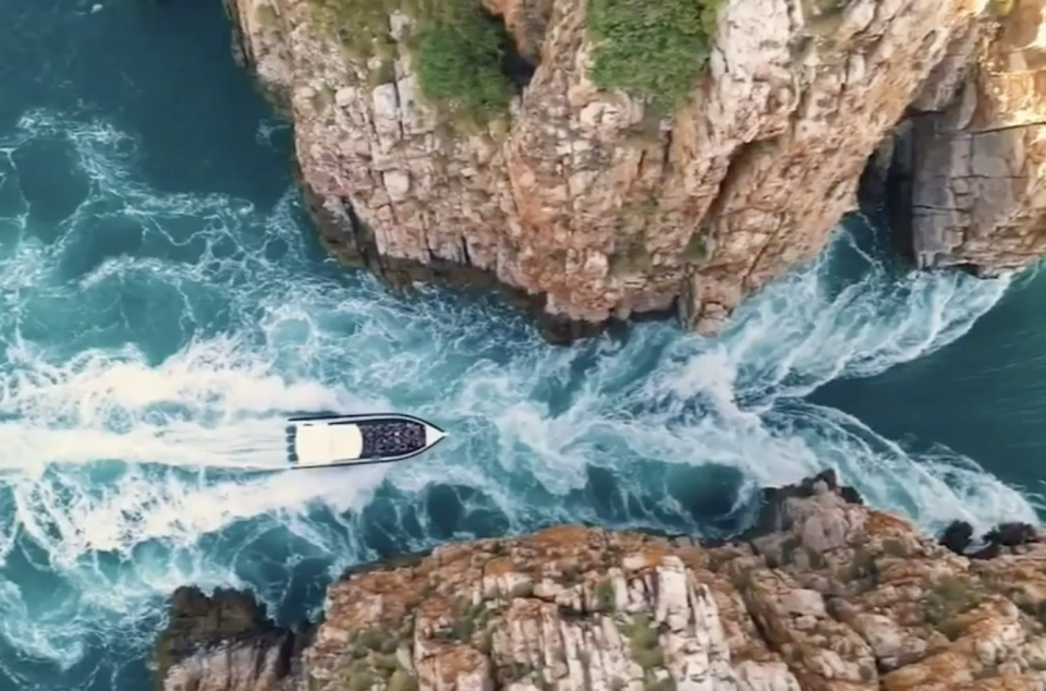 A boat passing through one of the gorges at Horizontal Falls. 