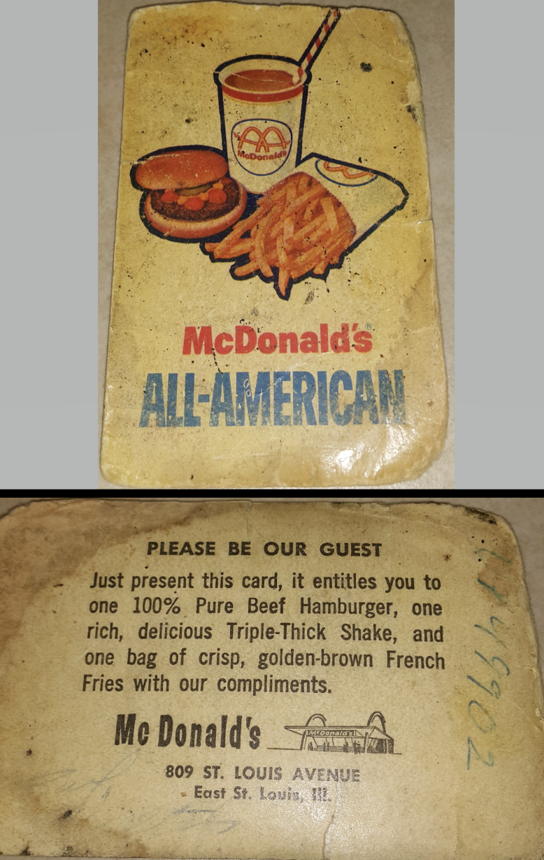 A vintage McDonald's "All-American" card displaying images of a burger, fries, and a drink. The card entitles the bearer to a free meal at the provided address